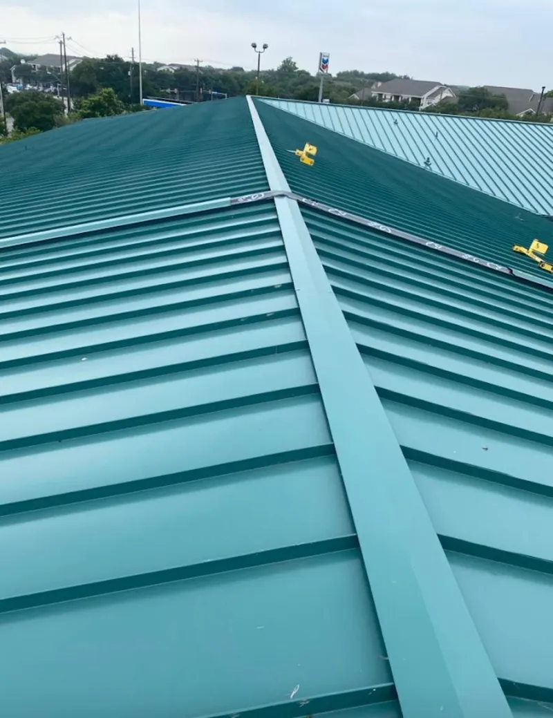 Green commercial metal roof ridge and valley for Metal Roof Repair in Vermillion