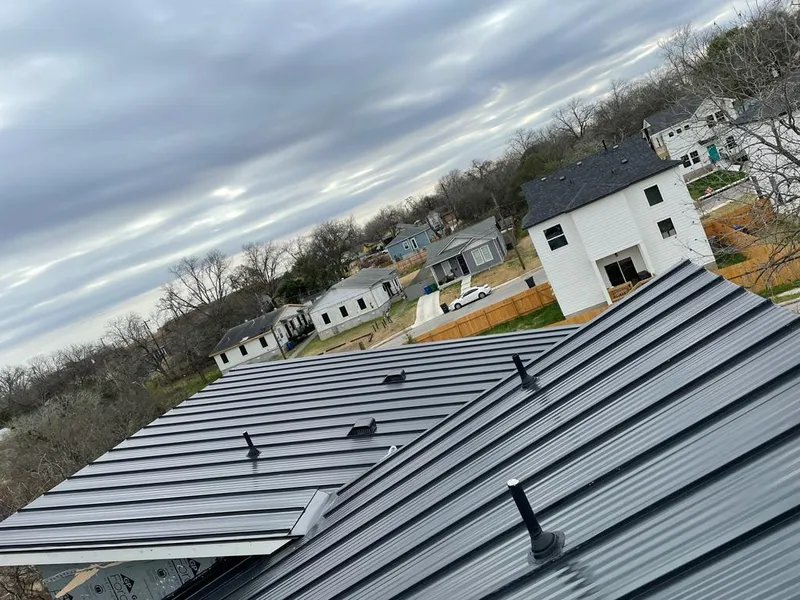 Standing seam metal roof panels with vents for Skylight Repair in Vermillion